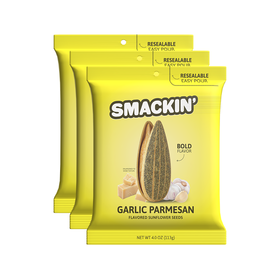 Product photography of three bright yellow Smakin' Garlic Parmesan flavored sunflower seed bags featuring a split seed, parmesan cheese, and garlic cloves, each with a resealable easy-pour top and bold flavor text