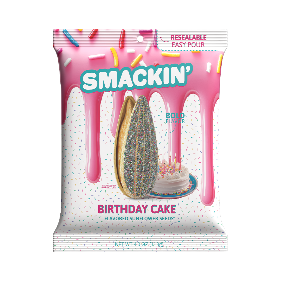 Smackin' Birthday Cake Flavored Sunflower Seeds bag featuring a pink icing drip design, scattered colorful sprinkles, an enlarged sunflower seed coated in rainbow confetti, and a small white birthday cake with lit candles