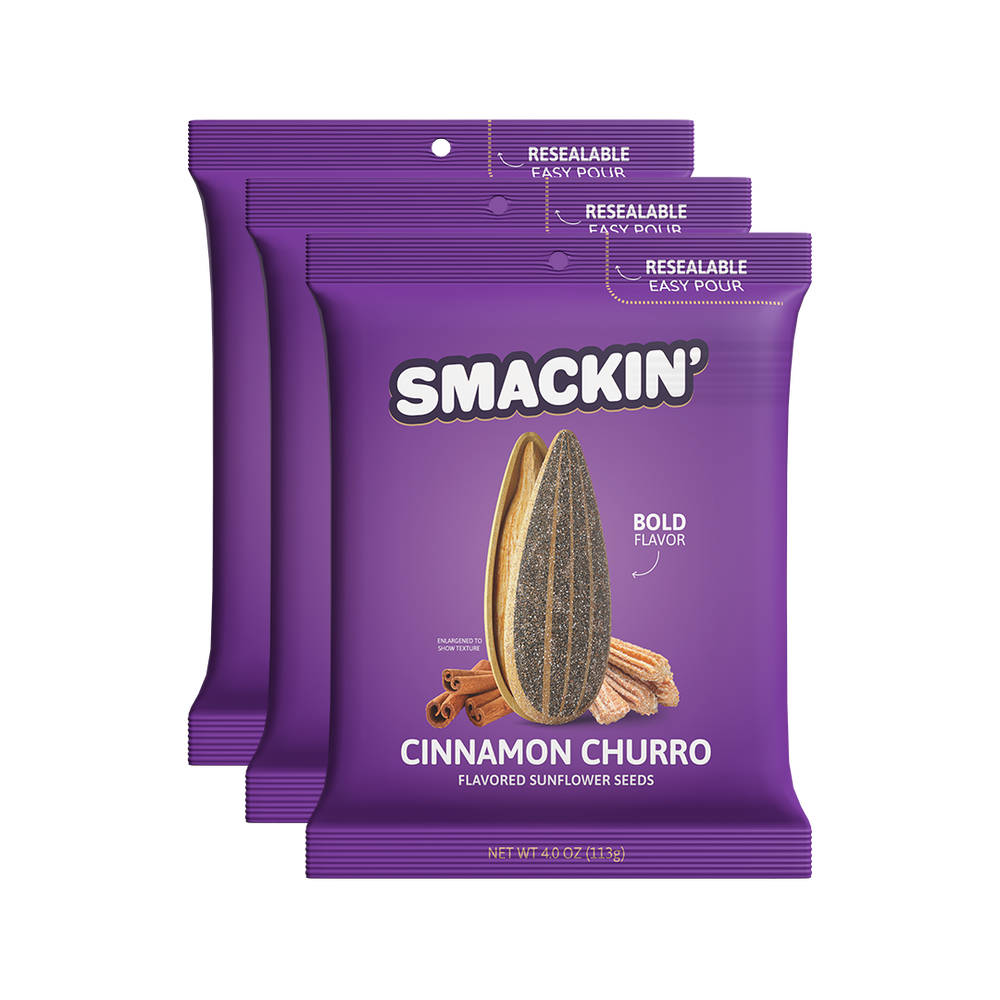 Three vibrant purple Smackin' Cinnamon Churro Flavored Sunflower Seeds packages featuring an enlarged seed churros and cinnamon sticks with resealable easy-pour tops