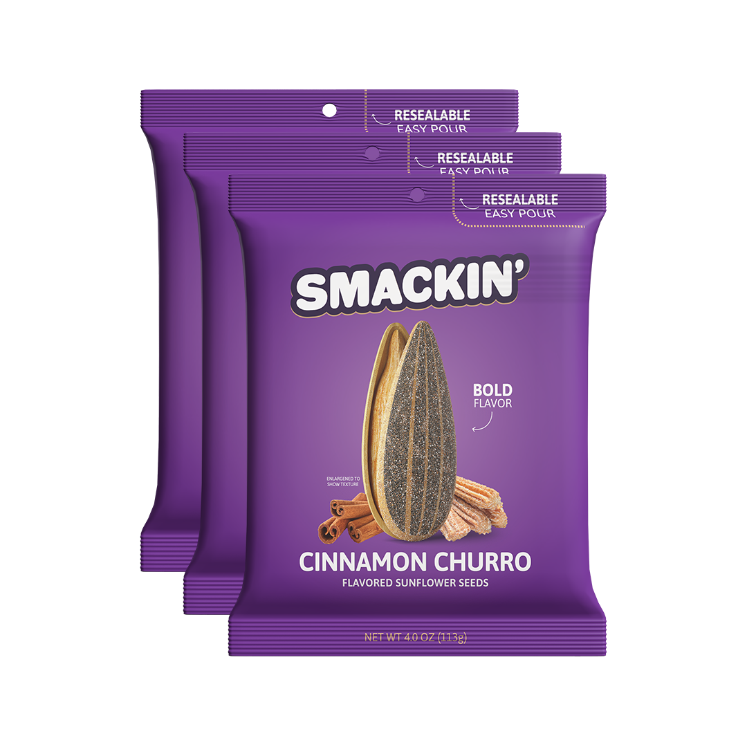 Three vibrant purple Smackin' Cinnamon Churro Flavored Sunflower Seeds packages featuring an enlarged seed churros and cinnamon sticks with resealable easy-pour tops
