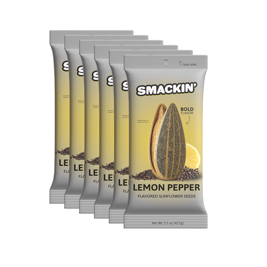 Product photography of six Smackin' Lemon Pepper Flavored Sunflower Seeds snack pouches isolated on a white background, each gray and yellow pouch displaying an enlarged striped sunflower seed, a vibrant lemon slice, and black peppercorns, highlighting the "Bold Flavor" and "Tear Here" opening