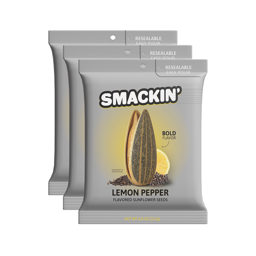 Product photography of three grey Smackin' Lemon Pepper flavored sunflower seed packages featuring 'Resealable Easy Pour' tops and a bold graphic of a split sunflower seed, lemon slice, and black peppercorns