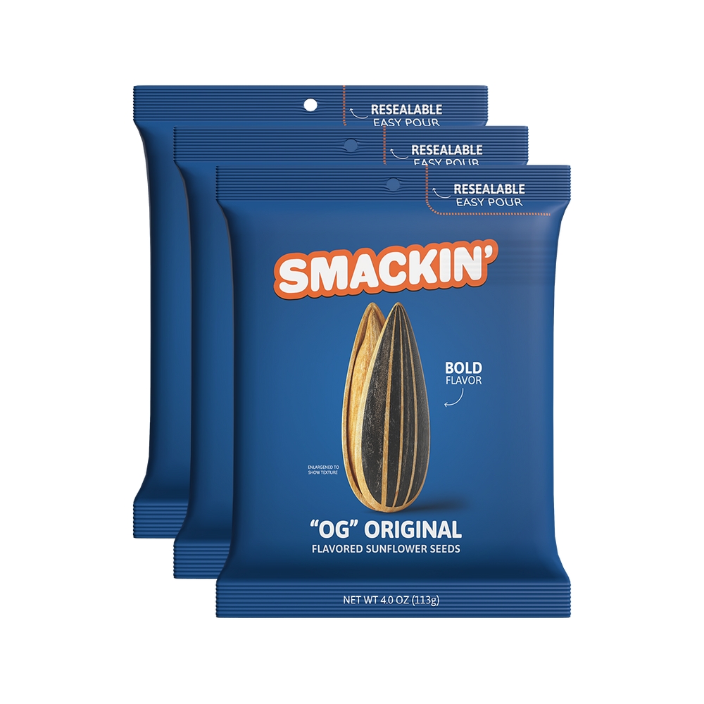 Product photography of three dark blue Smakin' OG Original Flavored Sunflower Seeds bags prominently featuring an orange Smakin' logo, a realistic striped sunflower seed illustration, and resealable easy pour tops