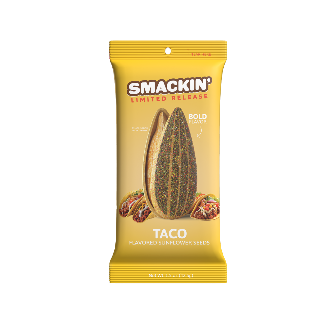 Digital image of a Smackin' Limited Release Taco Flavored Sunflower Seeds bag with vibrant yellow packaging, a large textured sunflower seed graphic, and three mini tacos illustrated at the base